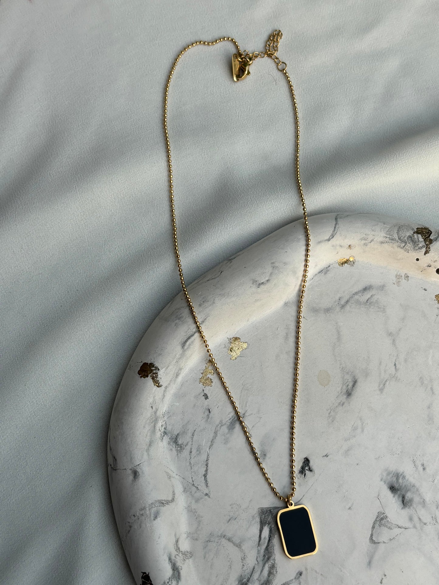 Black Stone Pendant with Gold Chain